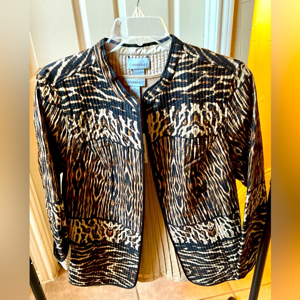 Animal print jacket and tan shirt by Catherine’s
